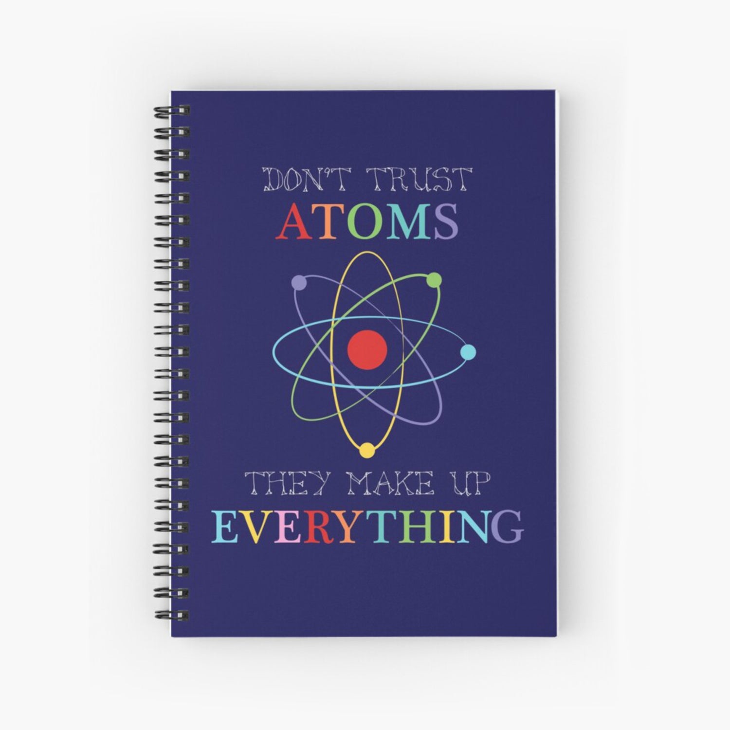 dark blue spiral notebook with Don't trust atoms on cover