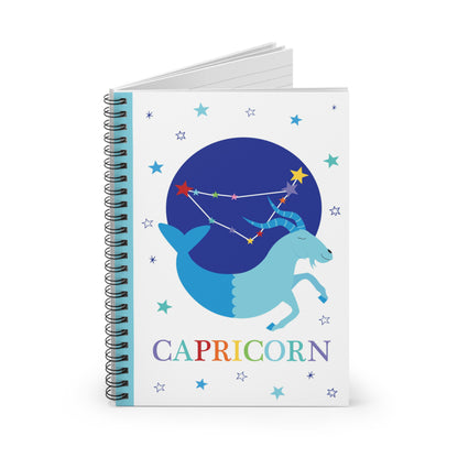Capricorn zodiac notebook partially open to reveal lined pages and spiral binding