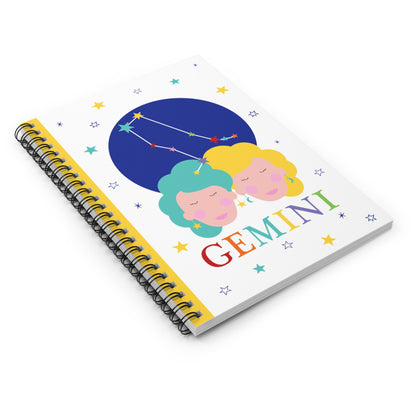 Angled view of the Gemini zodiac notebook with starry background and spiral binding