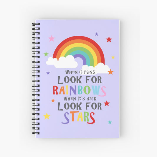 Spiral notebook with an inspirational quote on the cover design and colourful illustration