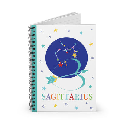 Sagittarius zodiac notebook partially open, revealing lined pages and a document pocket inside the back cover.