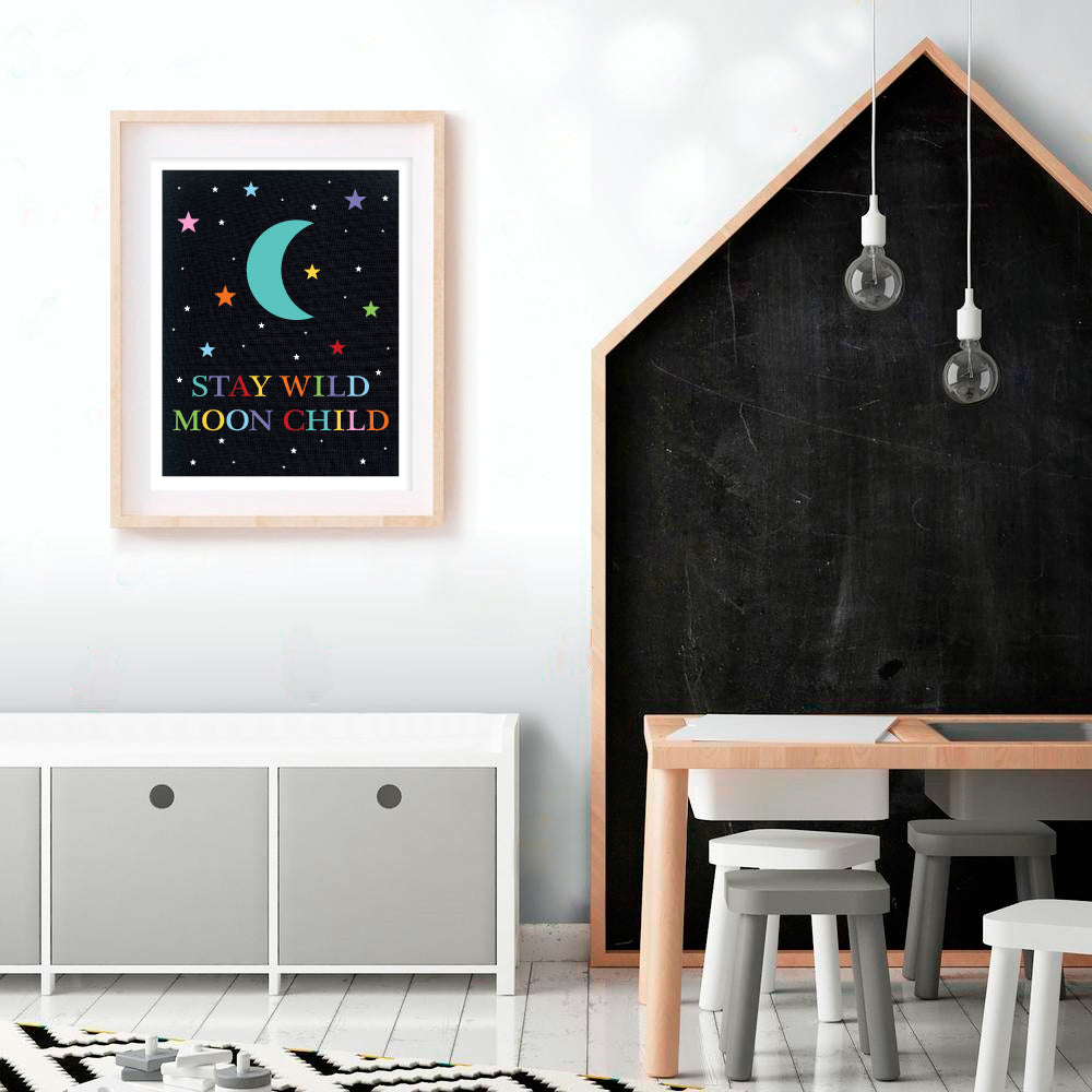 kids playroom with big chalkboard and black stay wild moon child print