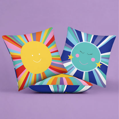 Colorful pillows with sun and moon designs front and back on a purple background