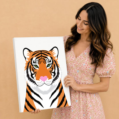 Woman holding a canvas print of a tiger with a pink heart nose 