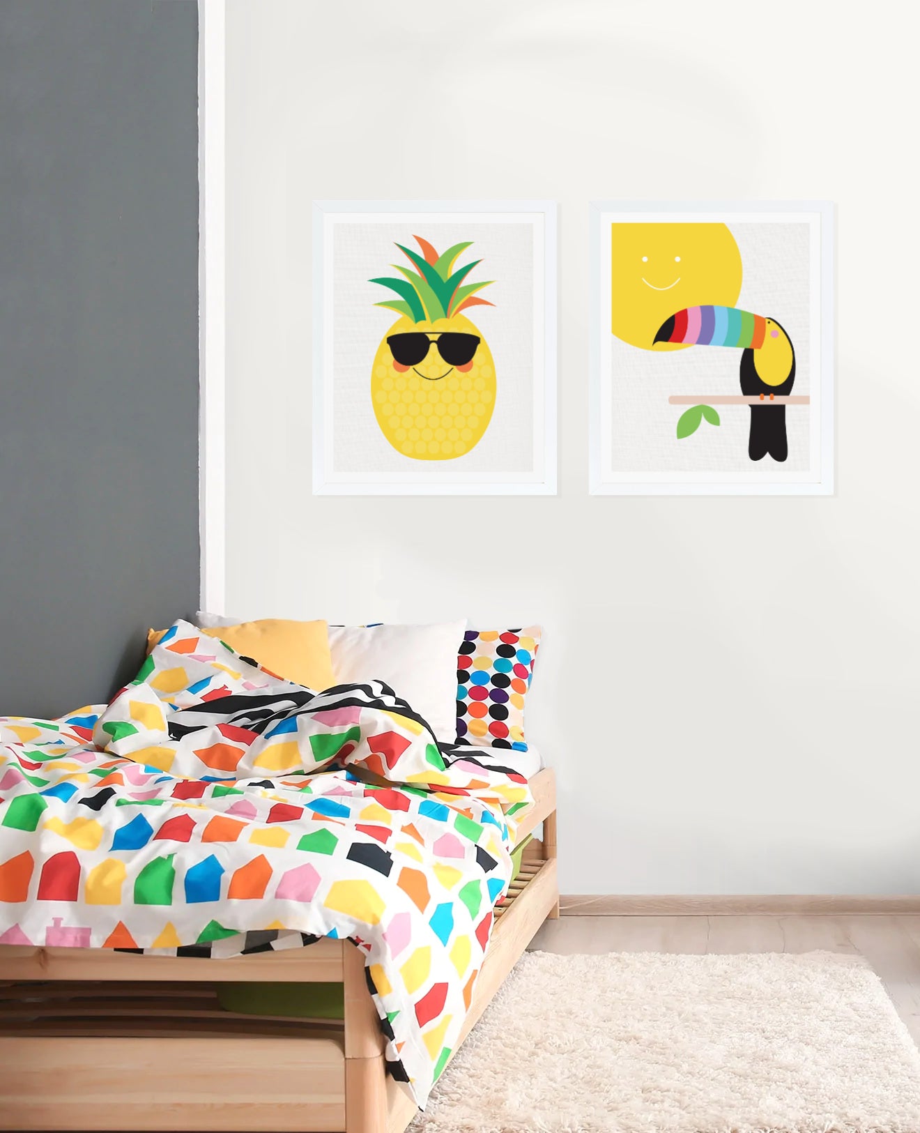 colourful kids bedroom with prints of pineapple and toucan on the wall