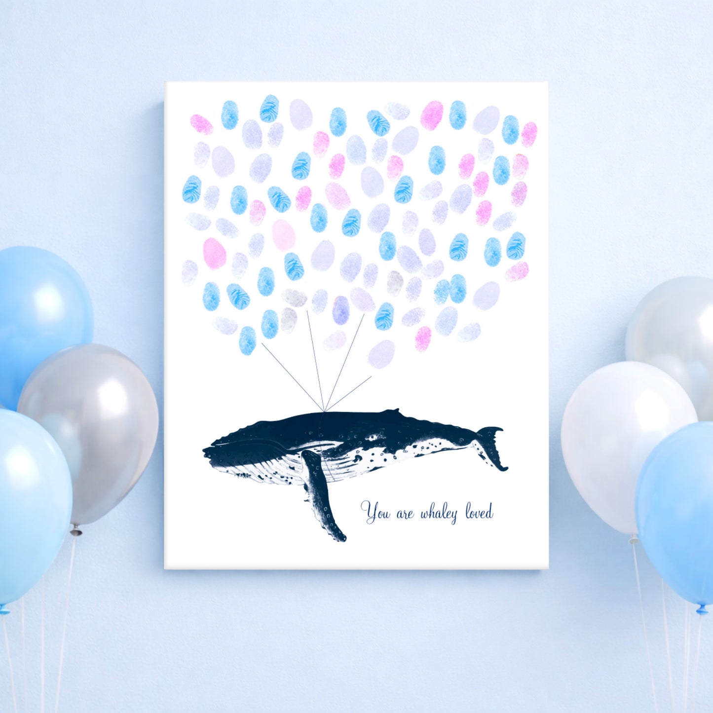 Guest book poster with humpback whale illustration and fingerprint balloons on a light blue background with balloons.
