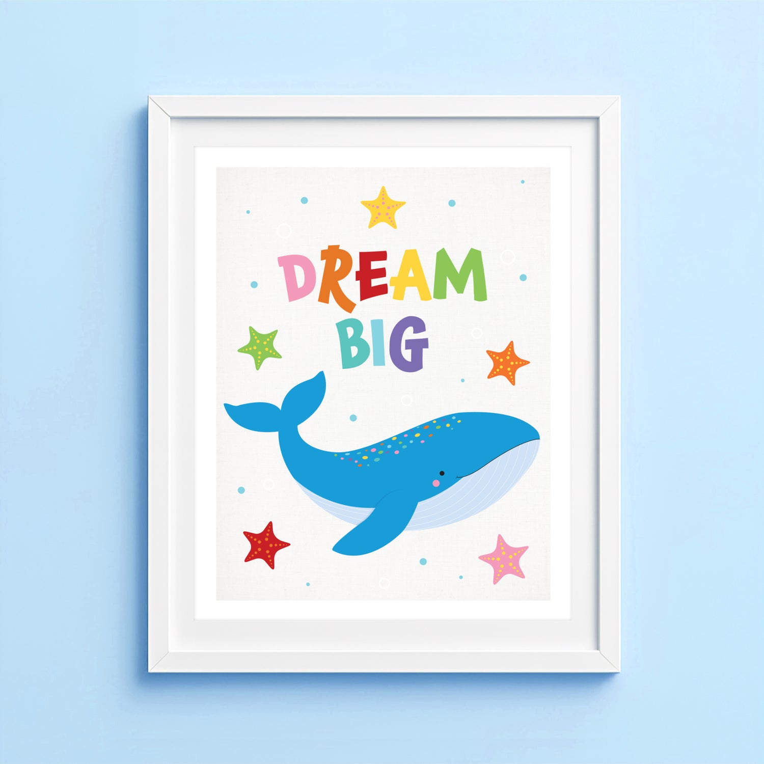 Dream Big whale art print featuring a colourful humpback whale and starfish for nurseries and kids bedrooms.