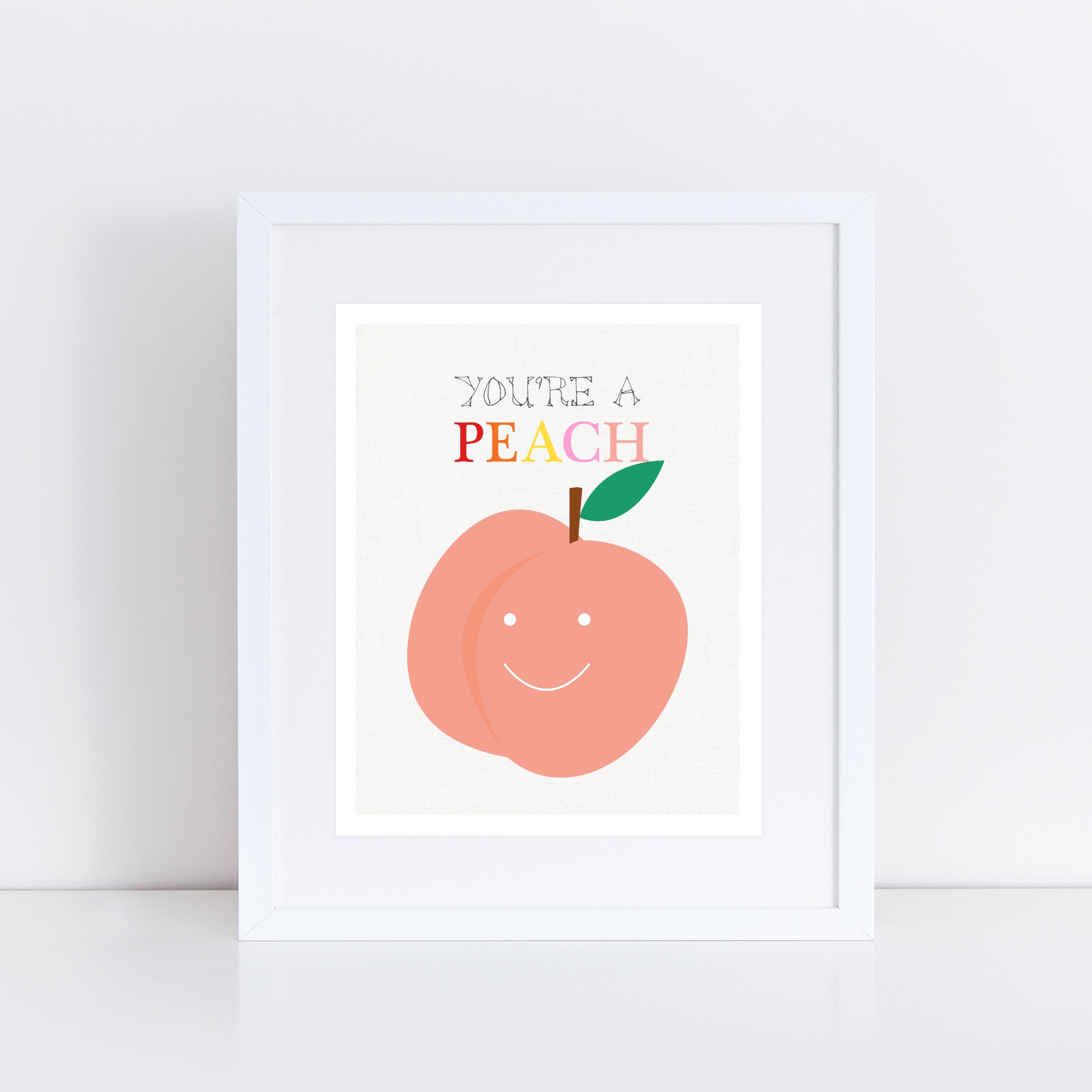 Smiling peach print in frame with the words you're a peach