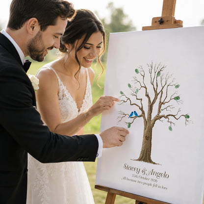 Colourful fingerprint wedding guest book alternative poster with bride and groom adding fingerprints to personalised tree artwork at outdoor wedding reception
