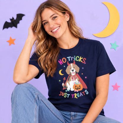 Woman wearing a navy Halloween t shirt featuring a beagle dressed as a devil with a pumpkin treat bucket and the words "No Tricks, Just Treats".