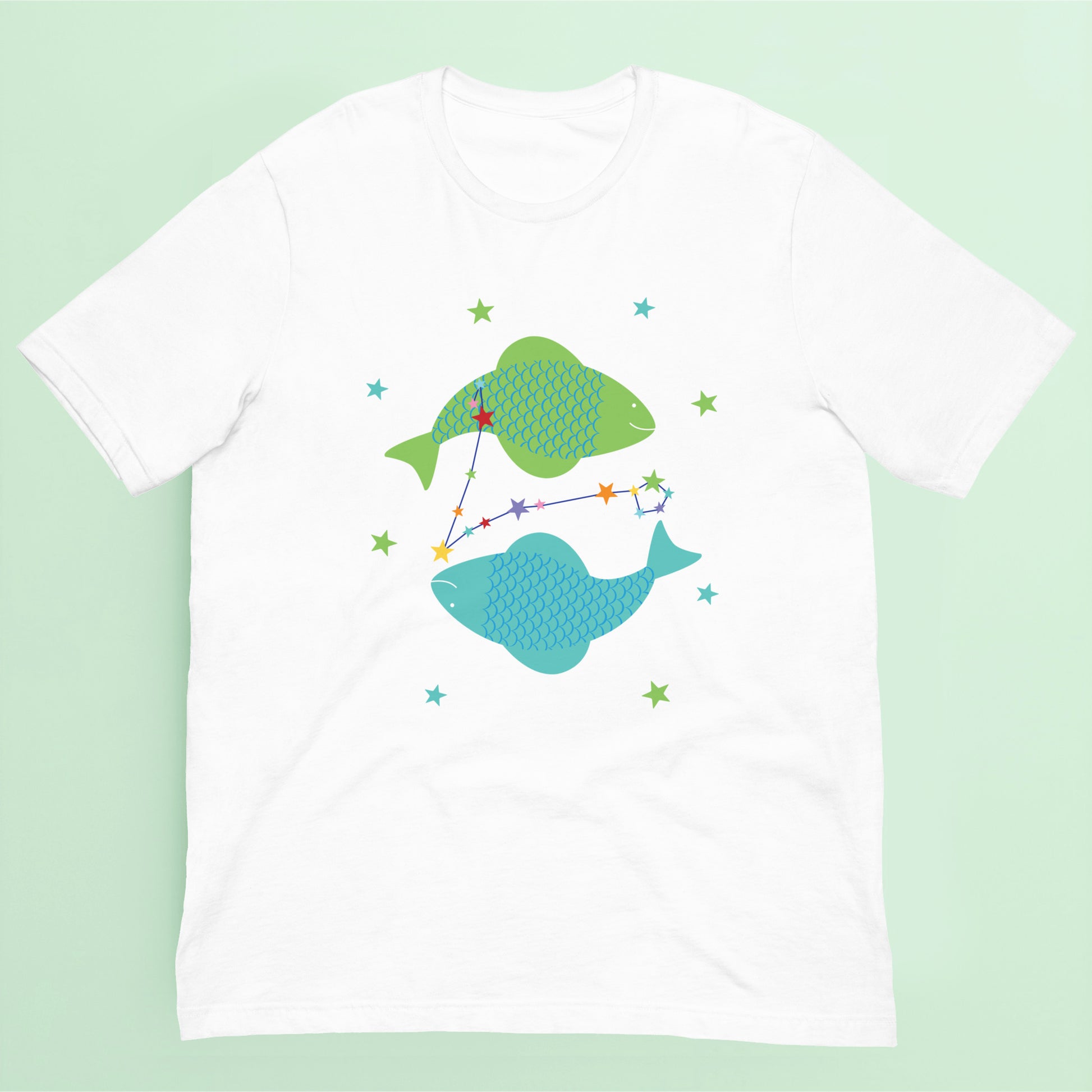 White t-shirt with green and blue pisces fish design on a green background