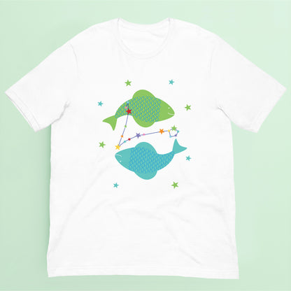 White t-shirt with green and blue pisces fish design on a green background