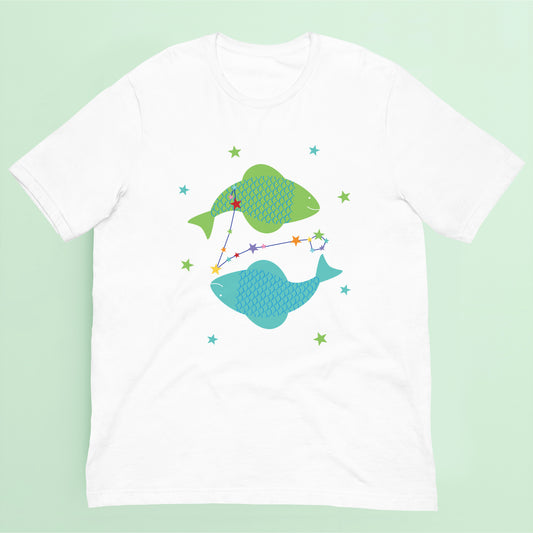 White t-shirt with green and blue pisces fish design on a green background