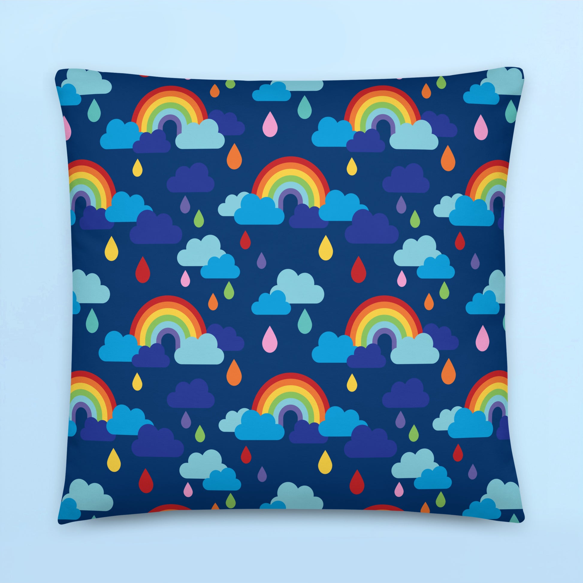 Rainbow clouds and colourful raindrops pattern cushion cover on navy blue background for colourful kids room décor
