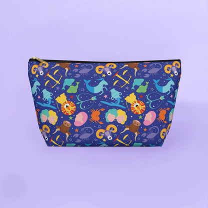 Colorful zipped pouch with astrological design on a purple background