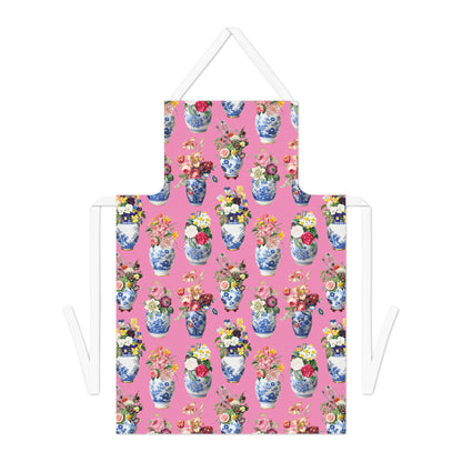 Pink apron with floral and vase pattern on a white background