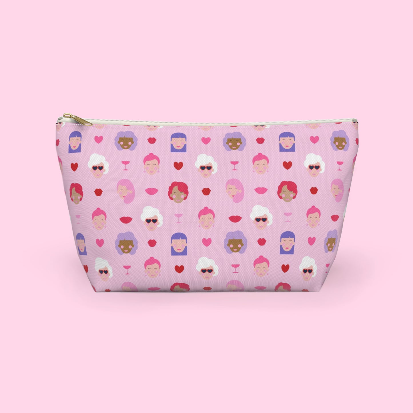Colourful Galentine themed accessory pouch featuring illustrated women, hearts and champagne glasses on a pink background with a gold zipper and flat bottom design by Creative Monsoon.