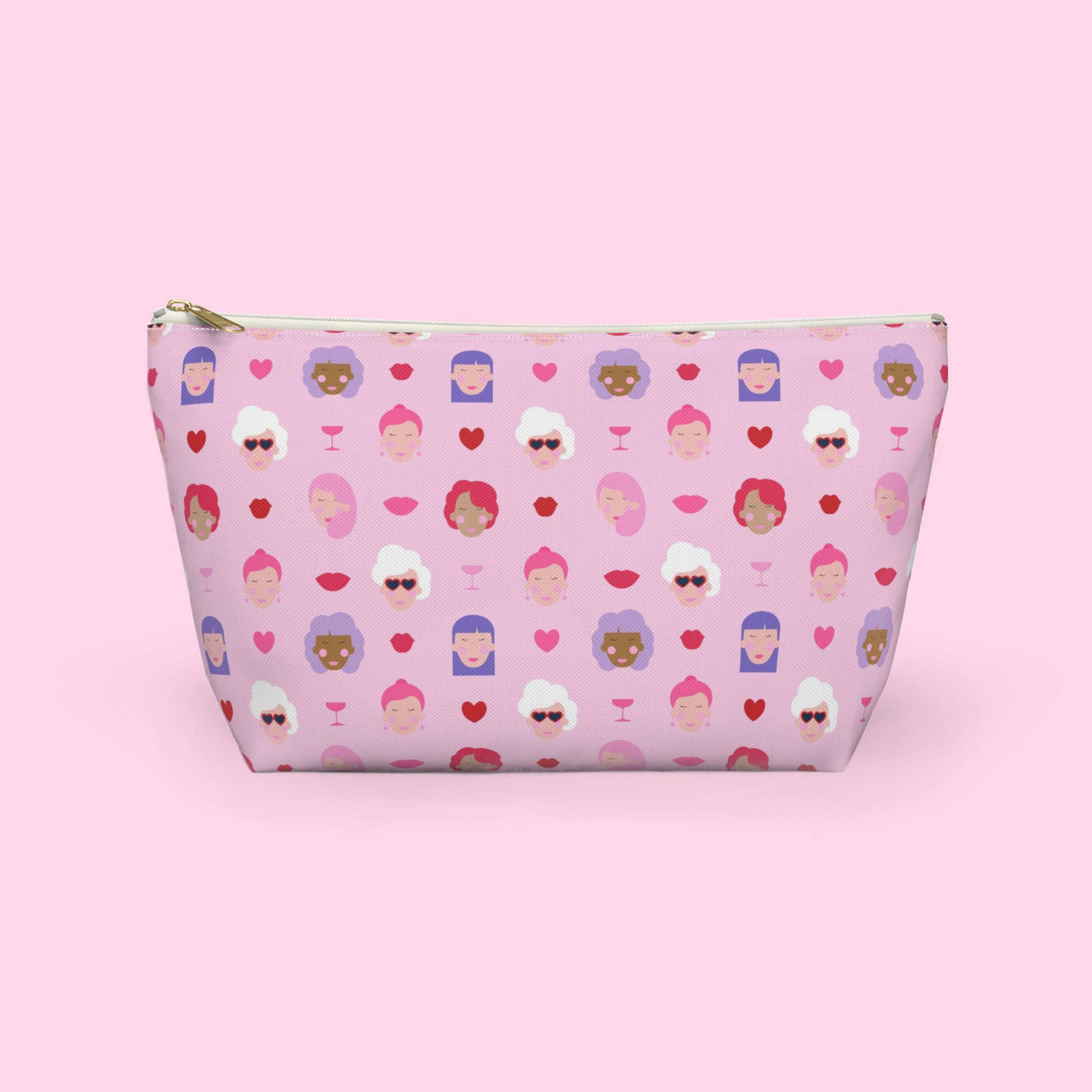 Colourful Galentine themed accessory pouch featuring illustrated women, hearts and champagne glasses on a pink background with a gold zipper and flat bottom design by Creative Monsoon.