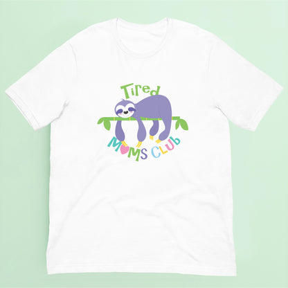 White t-shirt with a sloth graphic and 'Tired Moms Club' text on a light green background