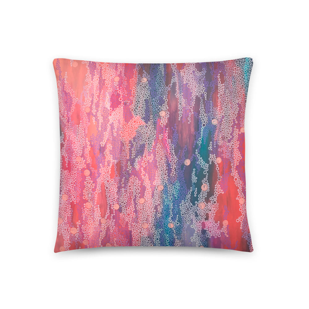cushion cover with pink abstract painting on it
