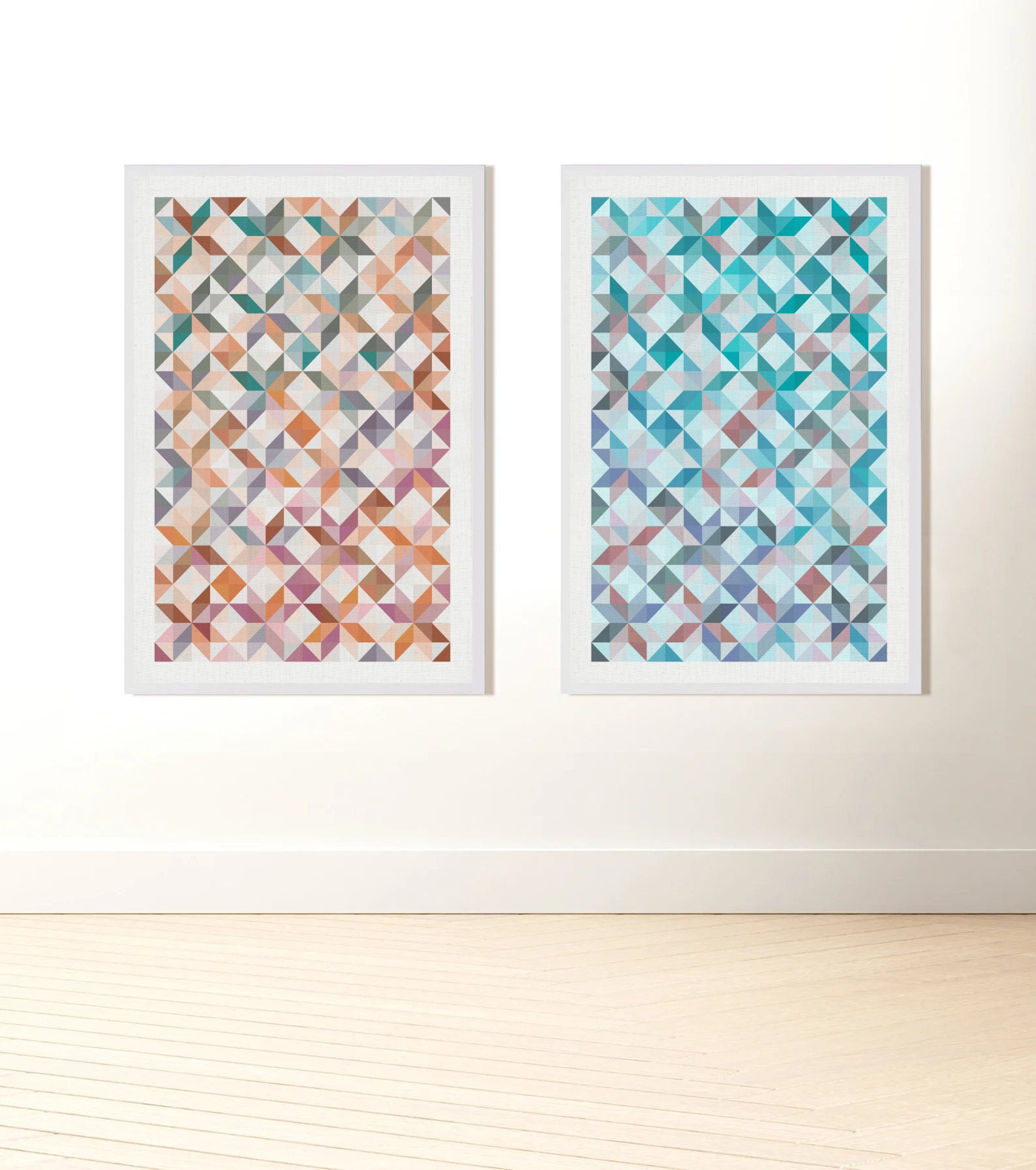 Two prints of  traditional patchwork patterns one mostly orange and one blue based, hanging on a wall