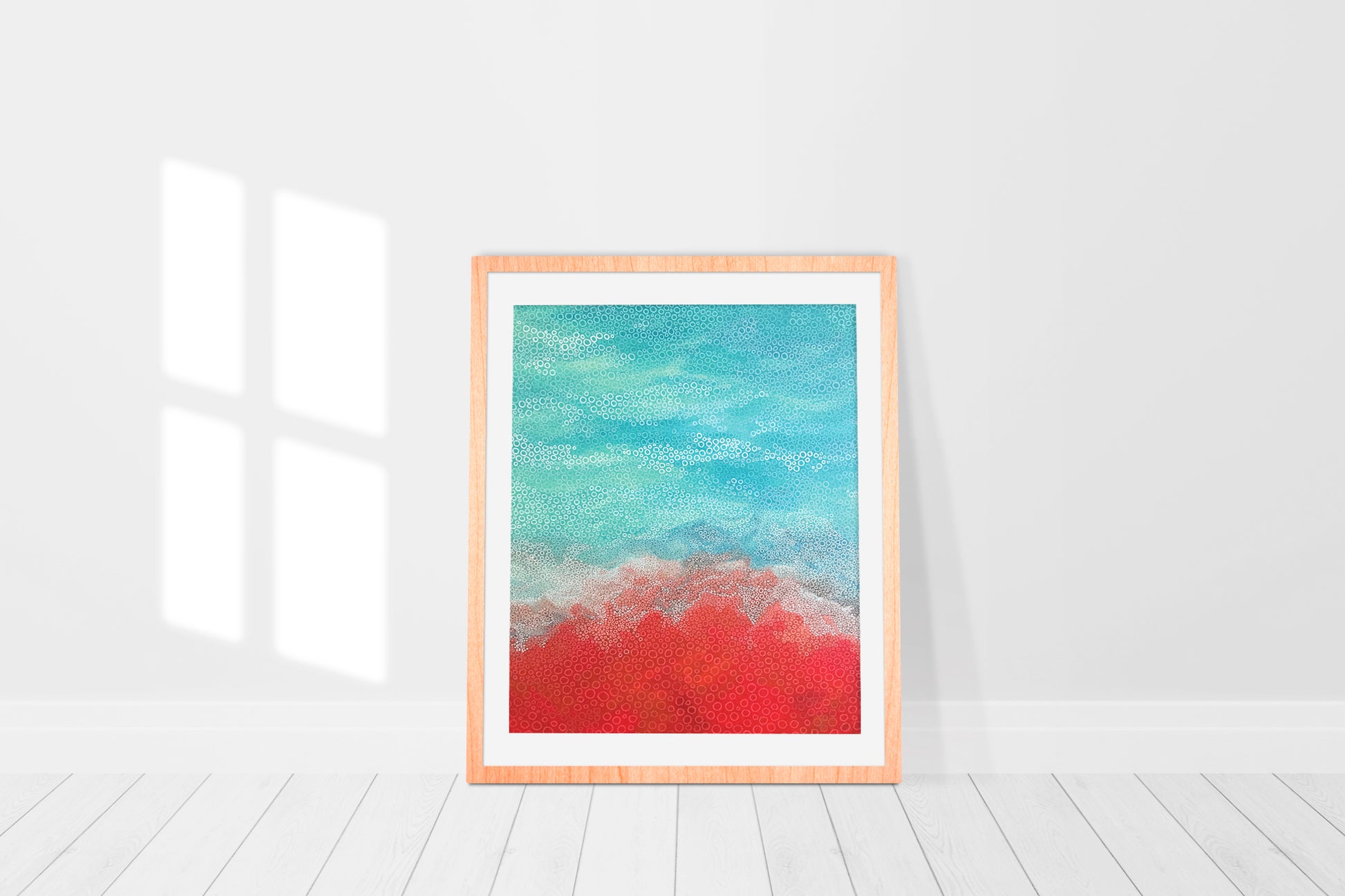 print in a frame of an original abstract painting of waves washing onto the beach in aqua and red