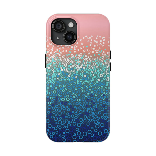 Phone case with a gradient design transitioning from pink to blue, featuring a pattern of small circles.