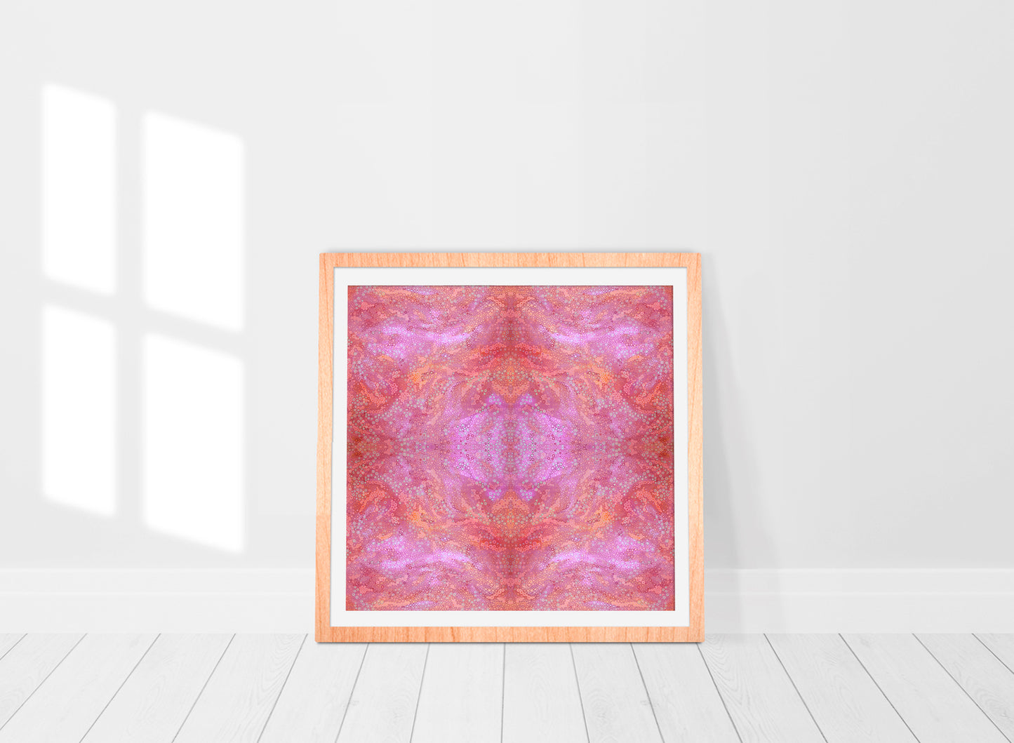 colourful abstract pink mandala print in frame with hundreds of circles and dots of various sizes