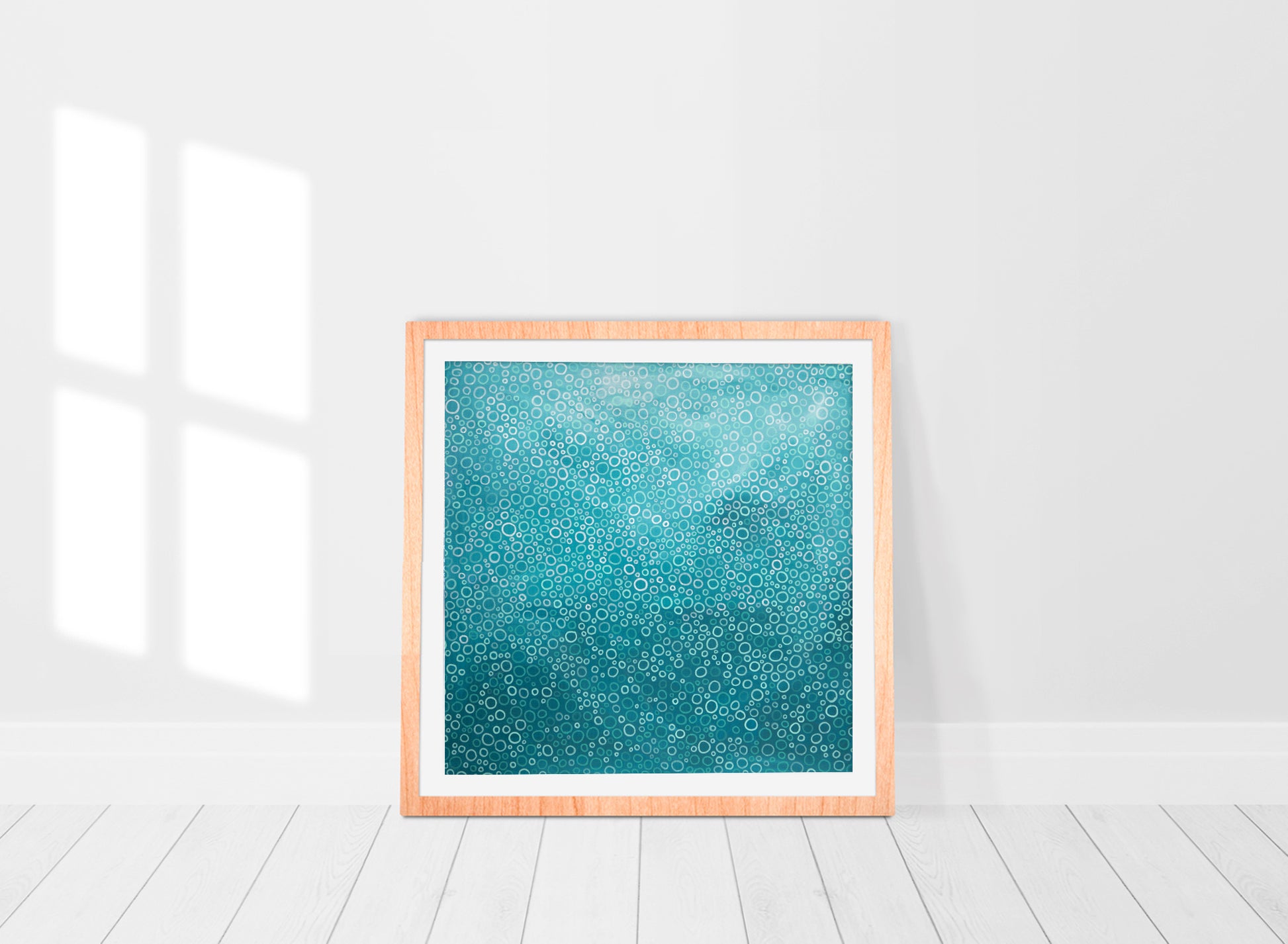 print of an original abstract painting In a mix of beautiful turquoise shades in a frame in a white room