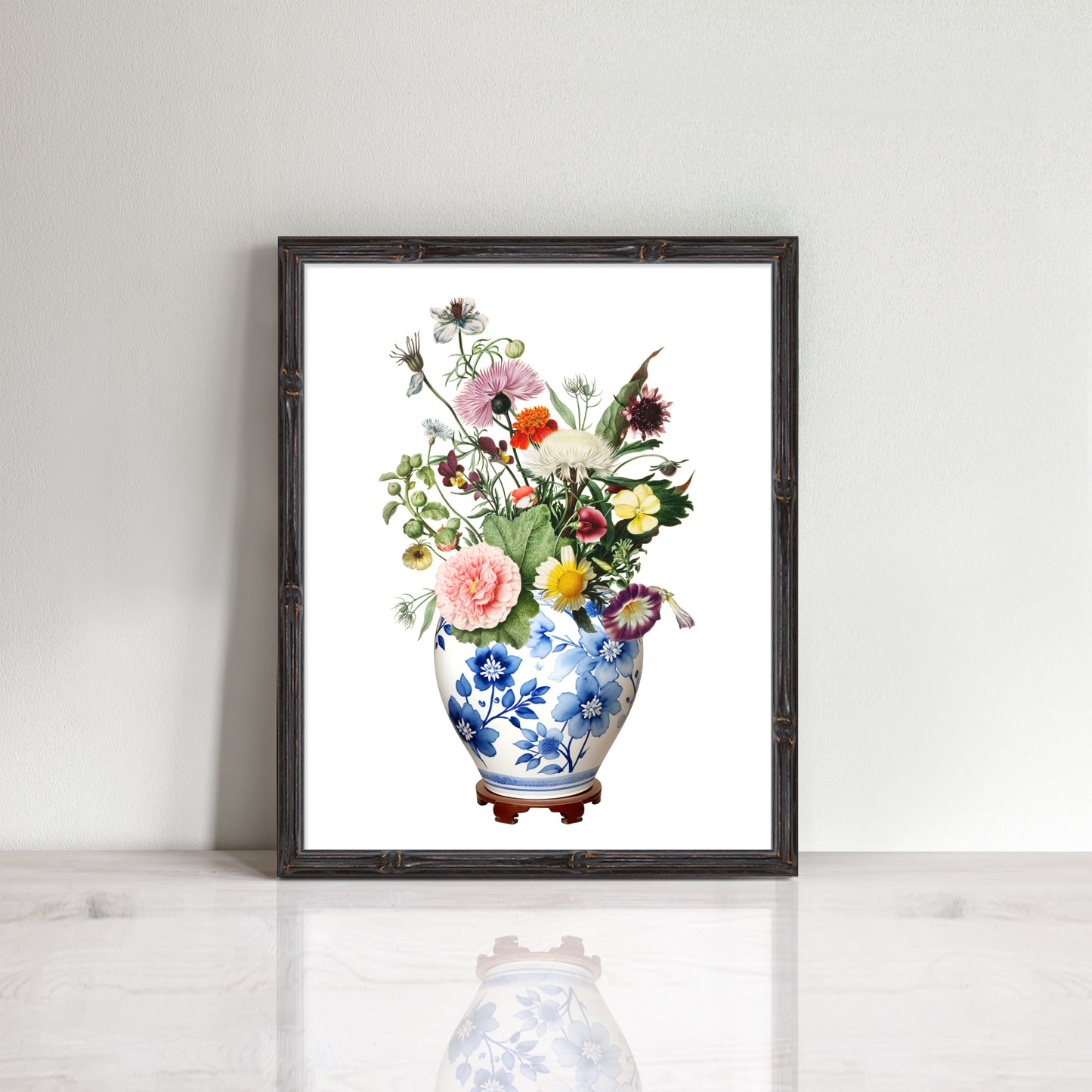 Ginger jar with pretty wildflowers print in a bamboo frame in a room