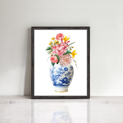 print in bamboo frame of pink and yellow flowers nestled in a classic blue and white china ginger jar