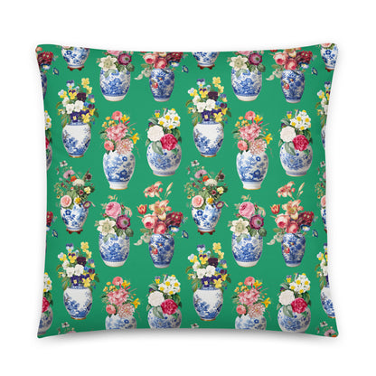 Pillow with floral and vase pattern on a green background