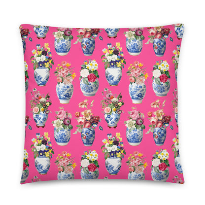 Decorative pillow with floral and vase pattern on a hot pink background