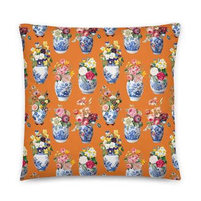 Pillow with floral and vase pattern on an orange background