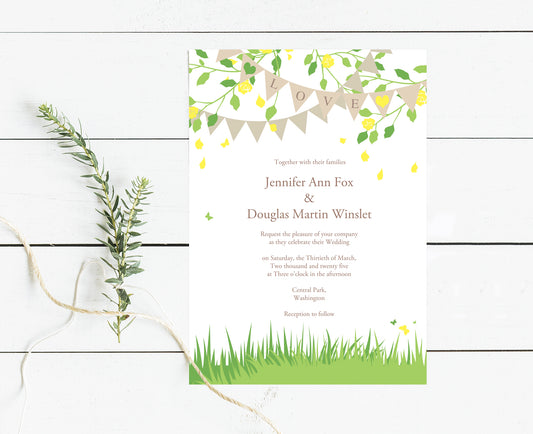 invitation with grass at the bottom and the words LOVE hanging from bunting in tree branches at the top