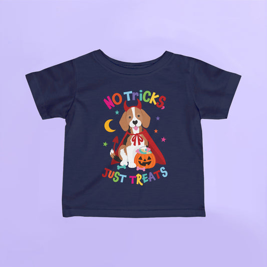 Navy kids Halloween t shirt featuring a beagle dressed as a devil holding a pumpkin treat bucket with the words "No Tricks, Just Treats".