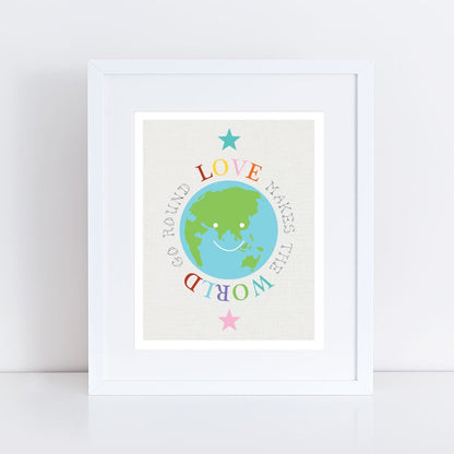 print of earth in frame with words Love makes the world go round around it