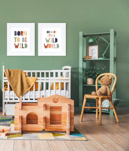 Green  jungle themed nursery with prints on wall over crib