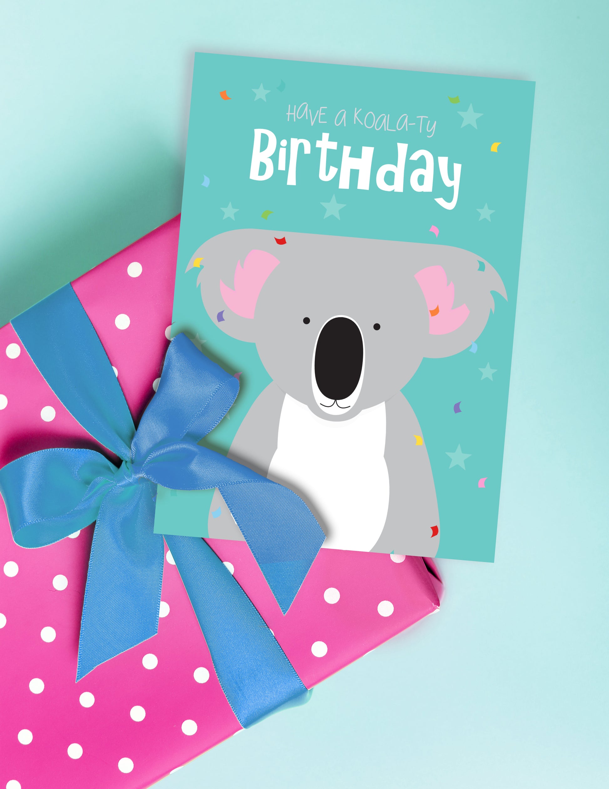 card features an adorable koala design sitting with gift